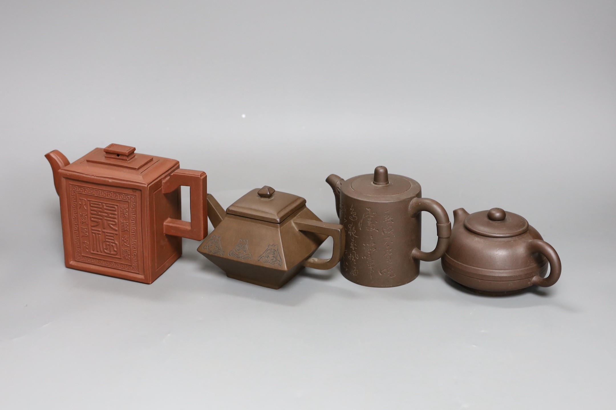 A Chinese Yixing rectangular teapot and three other Yixing teapots (4), Tallest 12 cms high